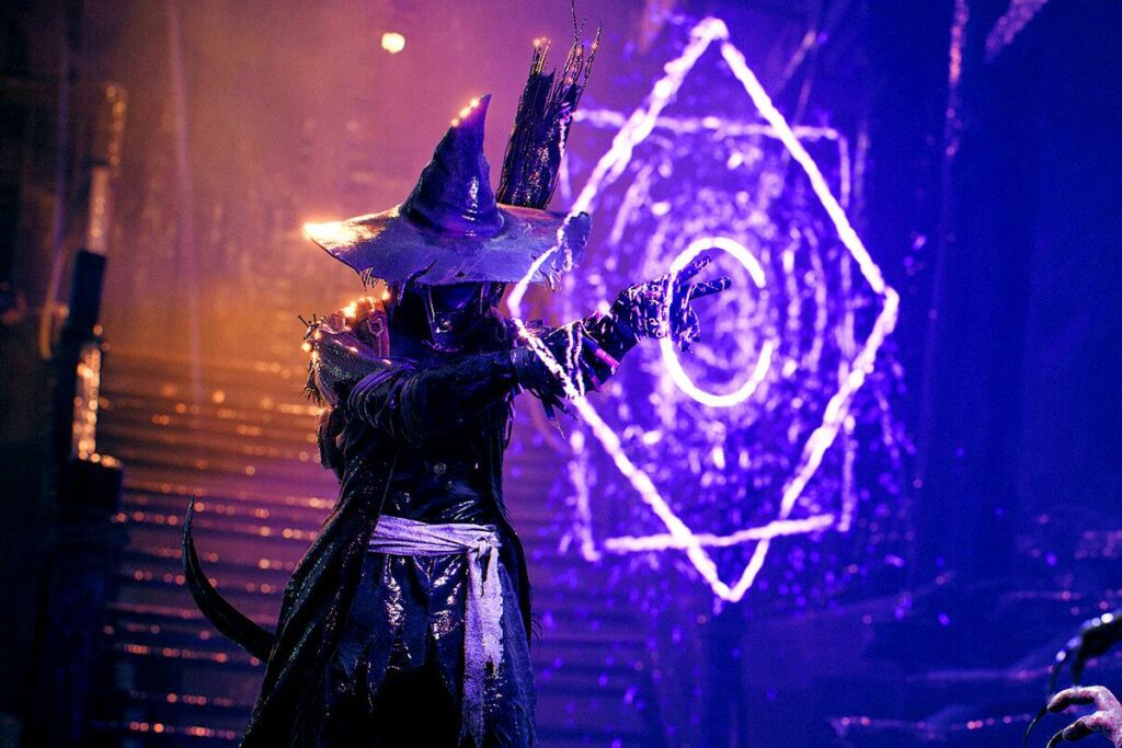 A mage in Remnant 2 using his magic to make a shield.