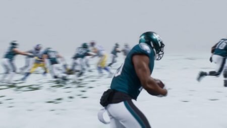 A player avoiding others in the snow in Madden NFL 26