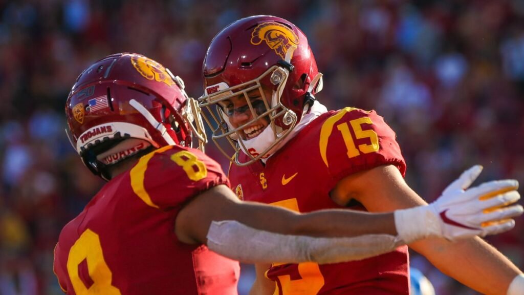 Amon Ra St. Brown playing football