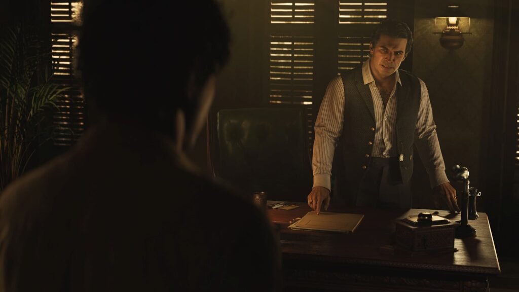 An angry man standing behind a table in Mafia The Old Country.