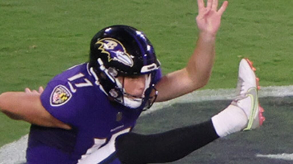 Cameron Dicker playing football