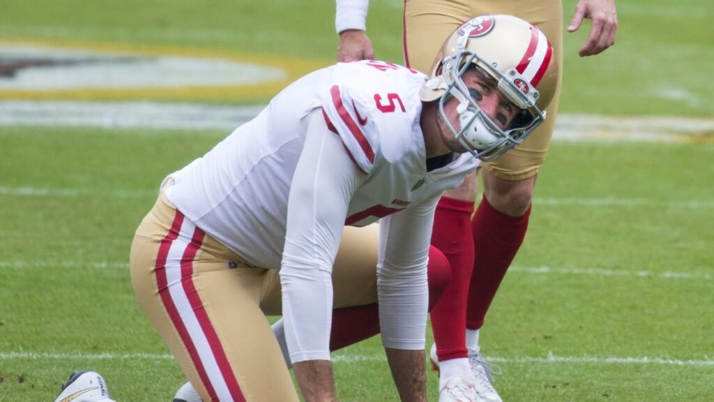 Robbie Gould Bradley Pinion playing football