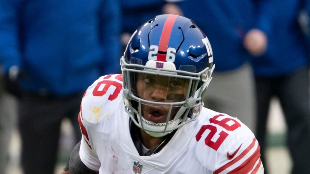 Saquon Barkley playing football