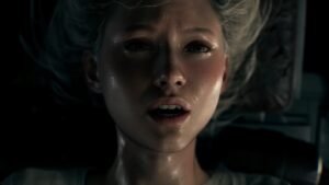 A blonde woman hangs upside down in Resident Evil Requiem