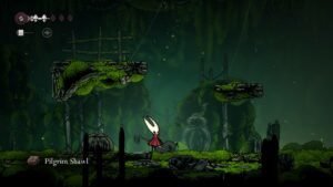 A screenshot of Hornet picking up a Pilgrim, Shawl in Hollow Knight Silksong