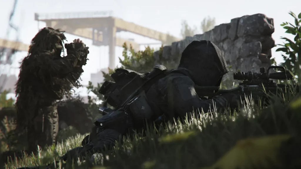 Image of COD MW4 player aiming with sniper rifle. A teammate wearing ghillie suit is using binoculars in the background