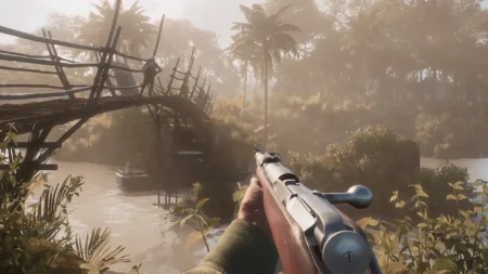 Image of Hell Let Loose Vietnam player aiming with rifler while soldier walks along wooden bridge