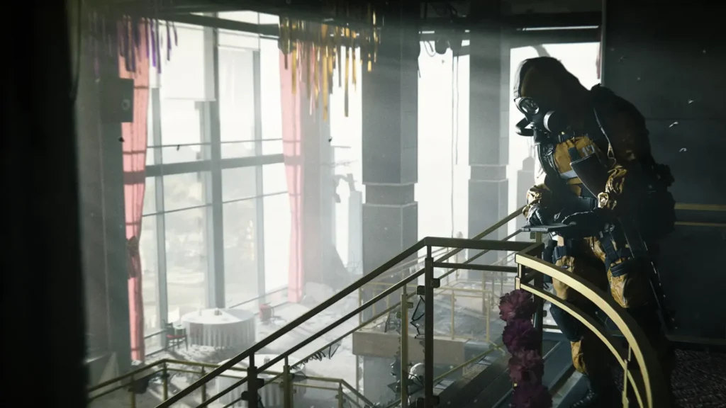 Image of Modern Warfare 4 player using device while stood at top of golden staircase
