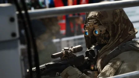 Image of Call of Duty MW4 player holding rifle while wearing goggles
